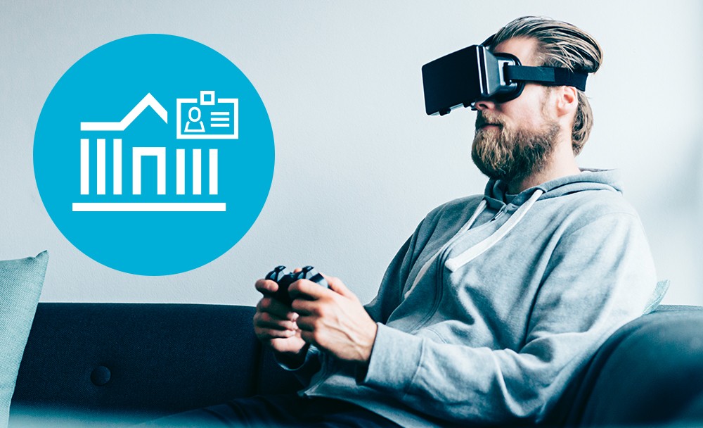 Man using virtual reality goggles borrowed from library Man using virtual reality goggles borrowed from library