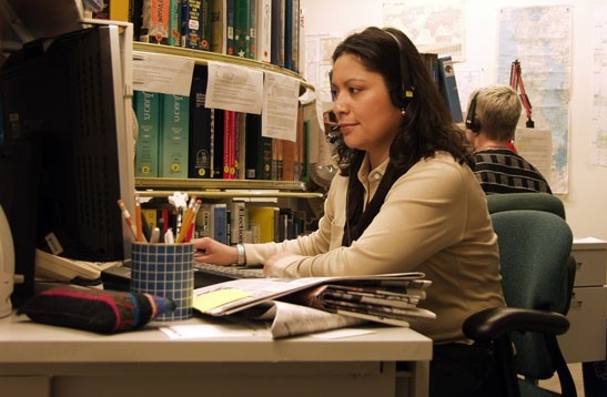 Female librarian using computer