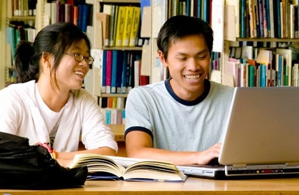Break down language barriers Asian students using a laptop computer