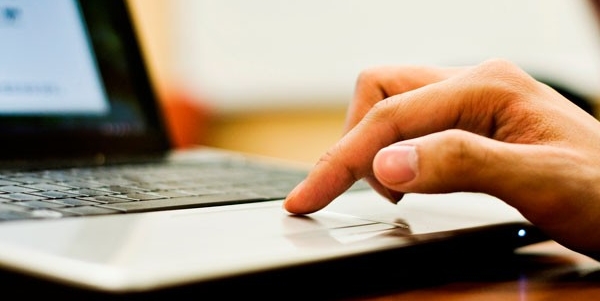 Get timely updates Person getting updates on a laptop