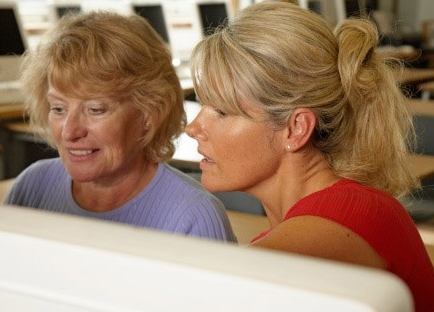 Two women using a computer