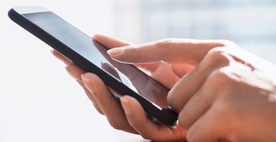 Closeup of person using a smartphone Closeup of person using a smartphone