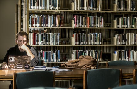 Student studying in Eastern Kentucky University Library Student studying in Eastern Kentucky University Library