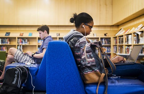 Students studying in Northeastern University Library
