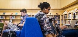 Students studying in Northeastern University Library