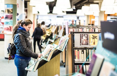 Rotterdam Public Library customer browsing books Rotterdam Public Library customer browsing books