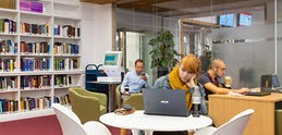 Students in a UCL library space