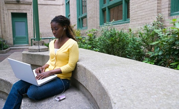 Student studying on laptop outside Student studying on laptop outside