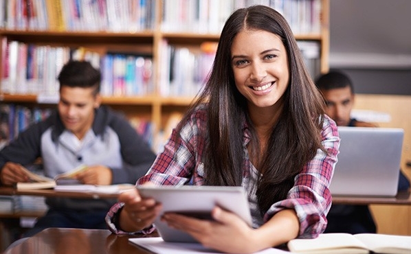 Student reading on a tablet