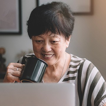 Photo: Senior woman doing online research Photo: Senior woman doing online research