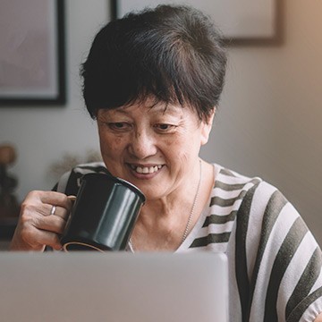 Photo: Senior woman doing online research